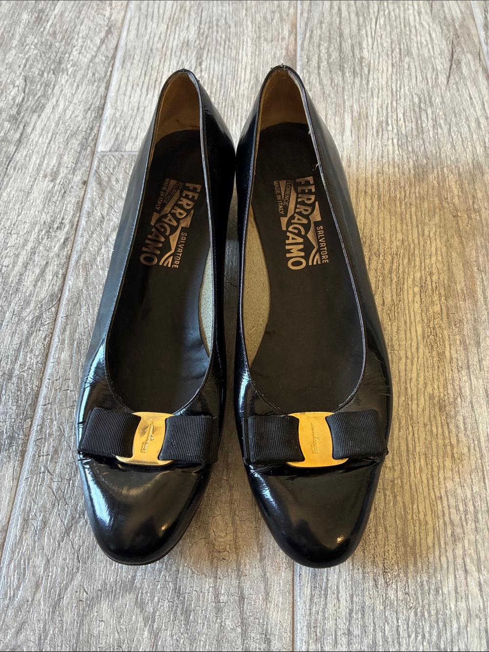 Salvatore Ferragamo Black Patent Leather Bow Flats with Gold Plaque